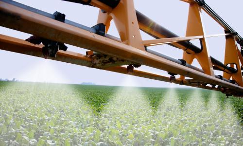 A machine sprayed a field of soybeans.