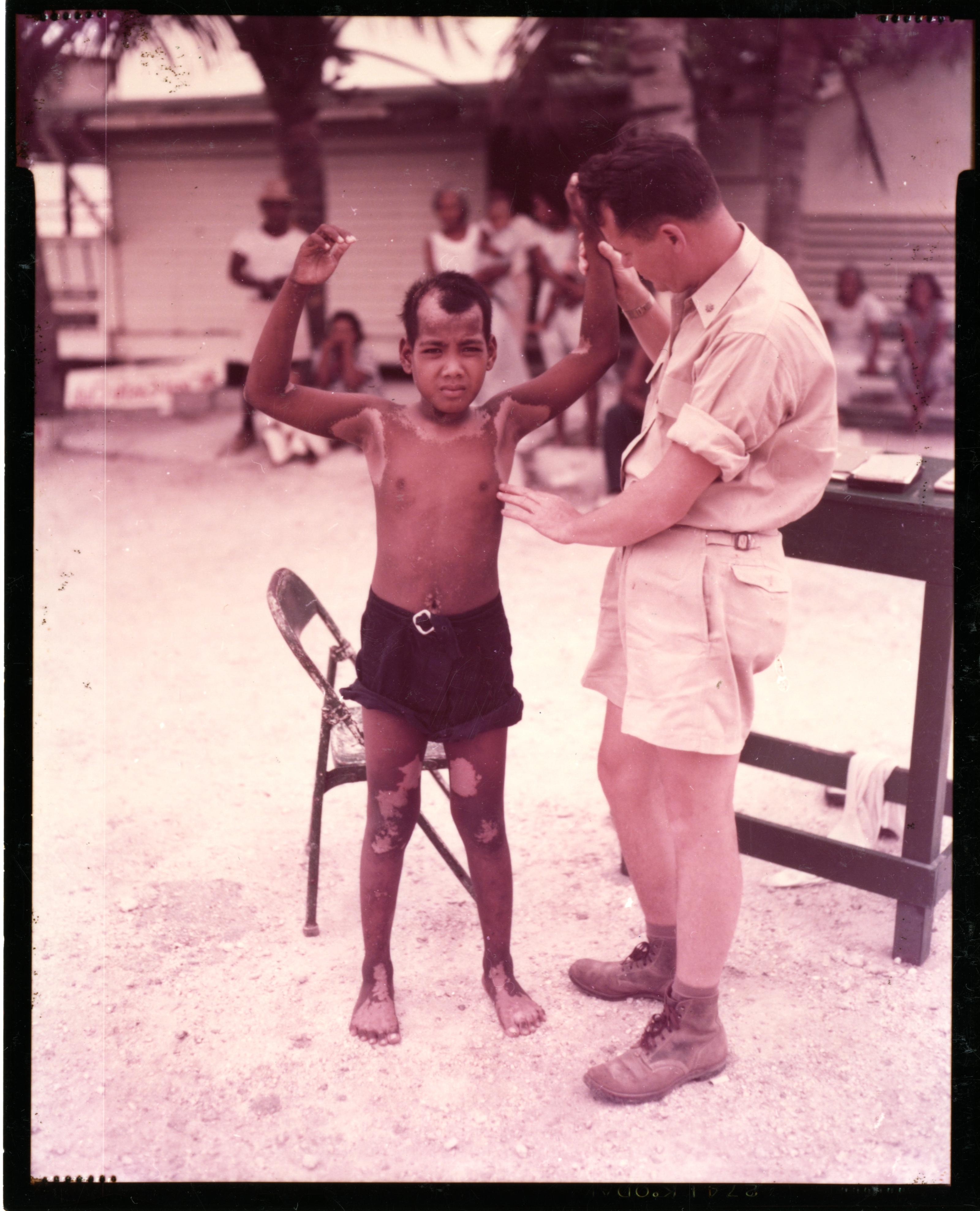 Dr. Conrad Examines Native Boy on Kwajalein